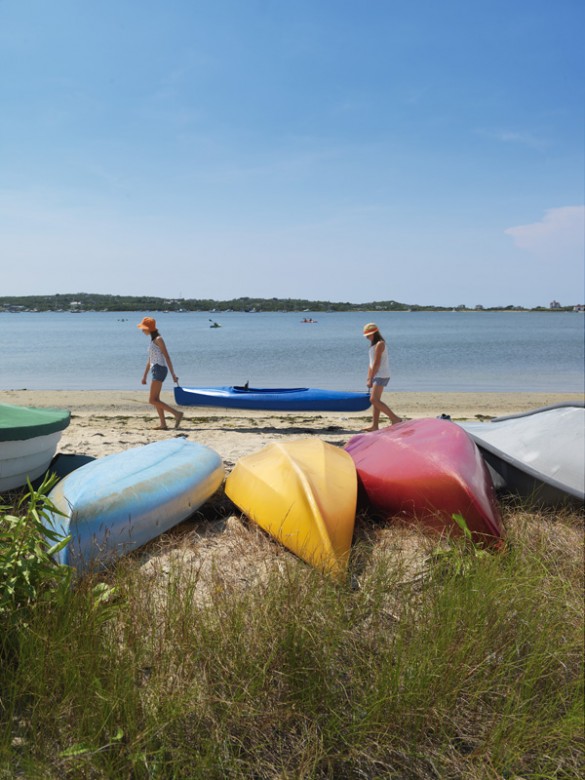 Colorful kayaks line the shores of The Great Salt Pond.