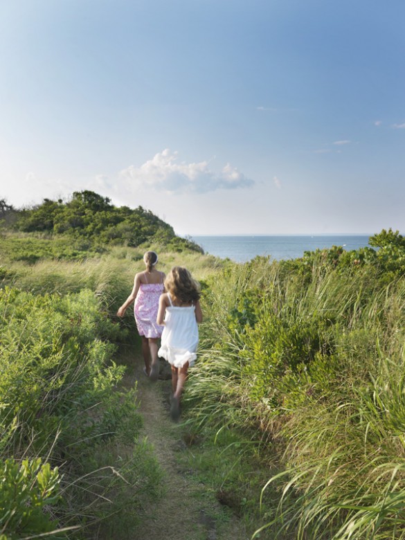 Girls run along Clay Head Trail, part of the The Nature Conservancy Preserve on the northeast part of the island.