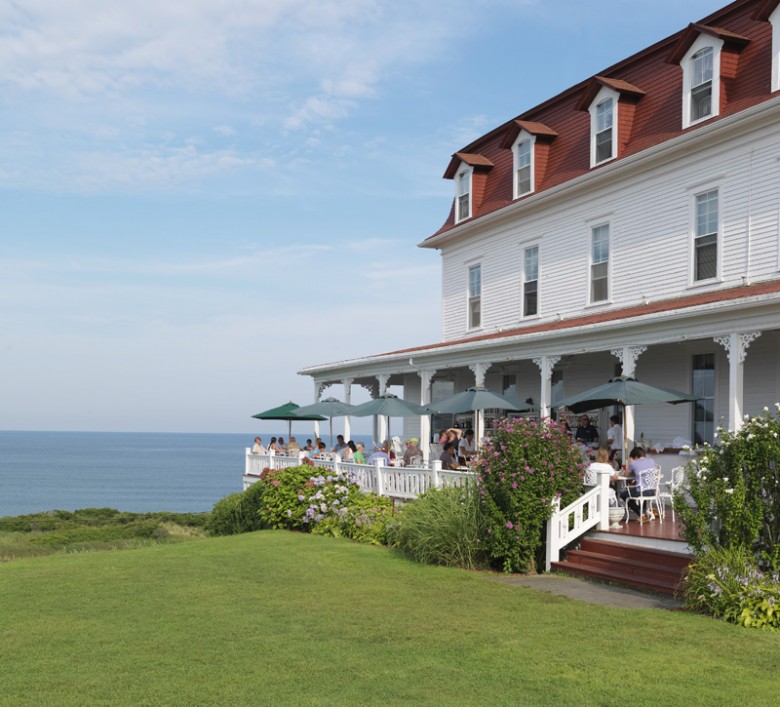 Diners enjoy the ocean views from the porch of Spring House Hotel. 