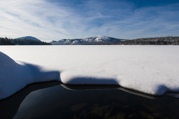 Fresh snow at the edge of Eagle Lake in Acadia National Park.