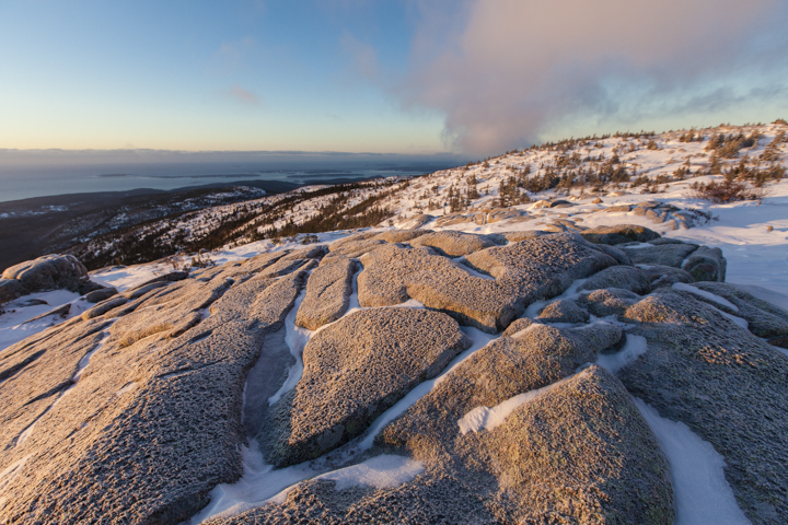 Sunrise on Cadillac Mountain in Acadia National Park after a winter storm.