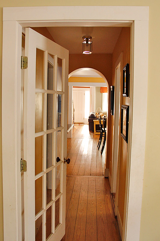 The hallway extends from the kitchen to the family room.