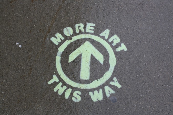 Stenciled messages on the sidewalk help you find other public art installations.
