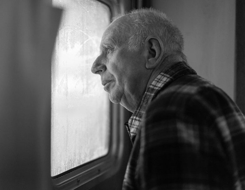 Isle au Haut resident Billy Barter gazes out one of the boat's windows.