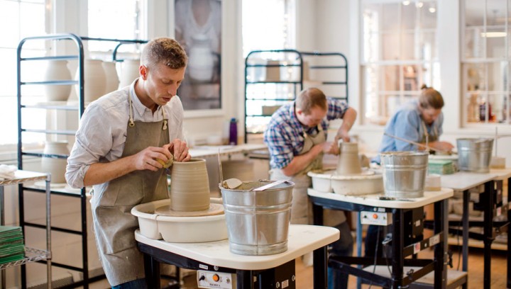 James Zilian spends more than half of his time at the wheel alongside his fellow potters in the workshop.