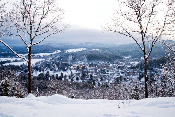 Woodstock is nestled under a soft blanket of snow in this photo taken from the summit of Mount Tom
