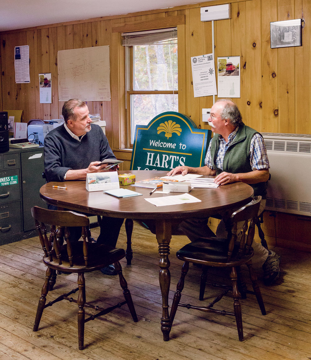 Hart’s Location Planning Board chairman Ed Butler (left) with Mark Dindorf, Hart’s selectboard chairman, at the town office. Following a hiatus that began in 1964, Hart’s returned to midnight voting in 1996, a decision that Butler championed. 
