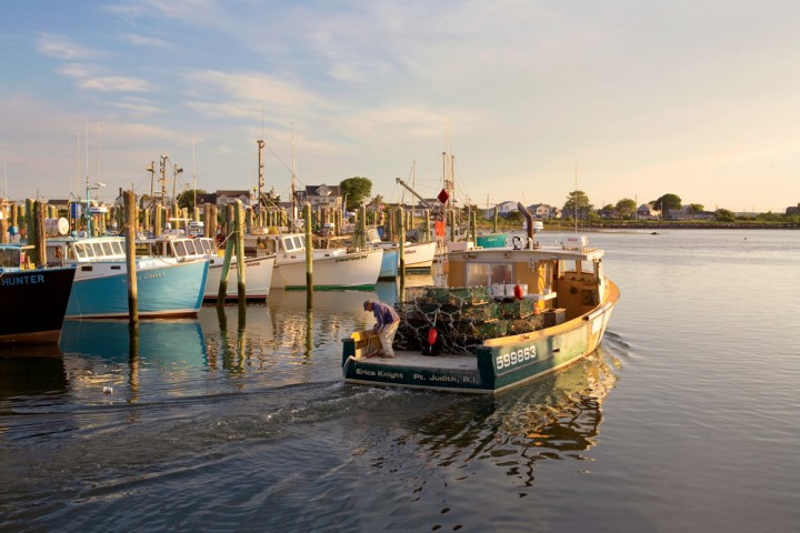 A lobster boat heads out from Galilee, a fishing village in the town of Narragansett, Rhode Island. Her home port is Point Judith, a small seaside community just a mile and a half away. 