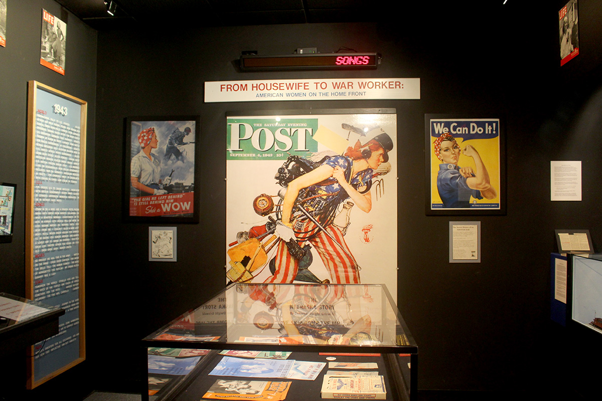 A Saturday Evening Post cover highlights the work of "women on the home front" at the Wright Museum of WWII.