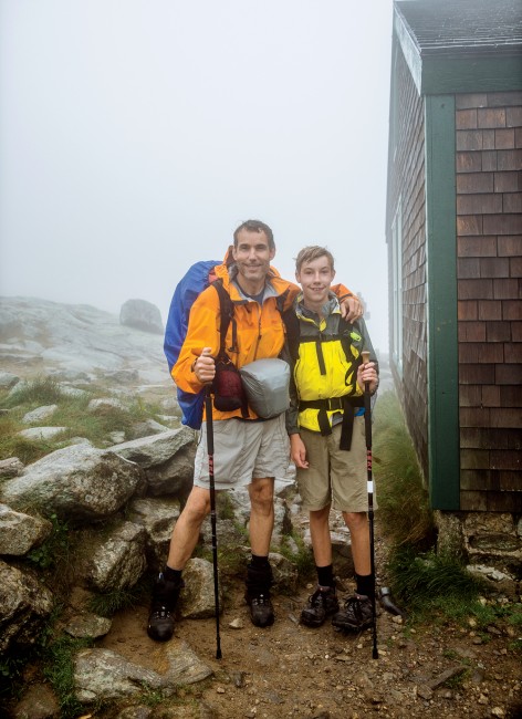 Day 6 Peter Nichol, a Concord, Massachusetts, science teacher, and his son Ayden arrive at Lakes of the Clouds Hut on Mount Washington, the highest hut along the entire AT, after a day hiking through rain and fog. ”No matter the weather, they were always smiling and enjoying the trek.”