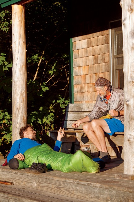 Day 4 “Stretch” and “Pizza Man” share thru-hiker stories in the early sun at Zealand Falls Hut.
