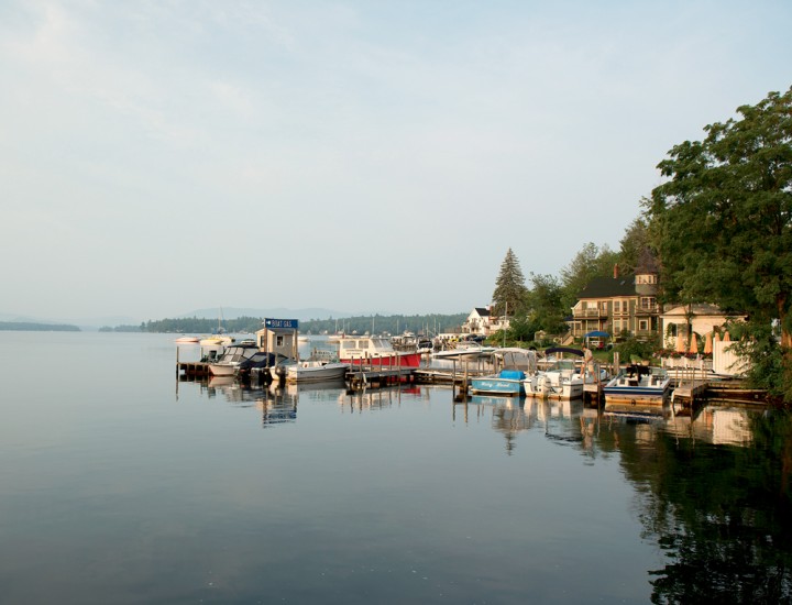 Wolfeboro Bay, just a block from Main Street, stretches out into Lake Winnipesaukee, edged by pleasure boats, comfortable homes, and a handy gas station for boaters on the fly.