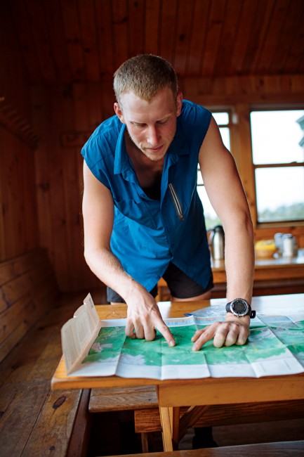 Days 2–3 End-to-end AT thru-hikers like Griffin Doninger, here planning his route at Greenleaf Hut, often work a few hours in exchange for a sleeping-pad spot on the floor and fresh meals. 