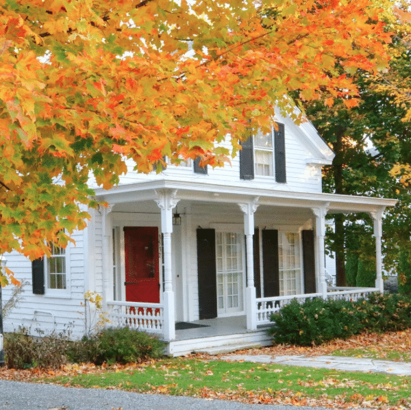 Red door, orange leaves in Manchester Vermont