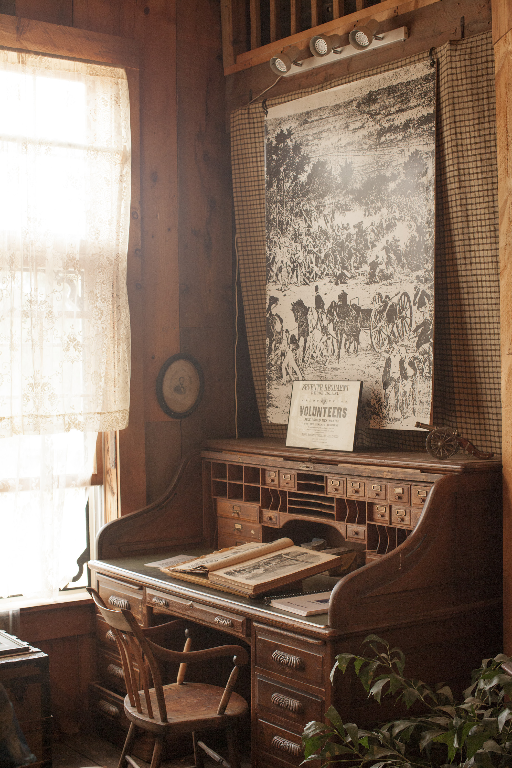 A vintage railway desk in the Metz Exhibit Hall at the South County Museum. The hall houses the museum's permanent collection including the Victorian Kitchen, the General Store and Native American exhibits.