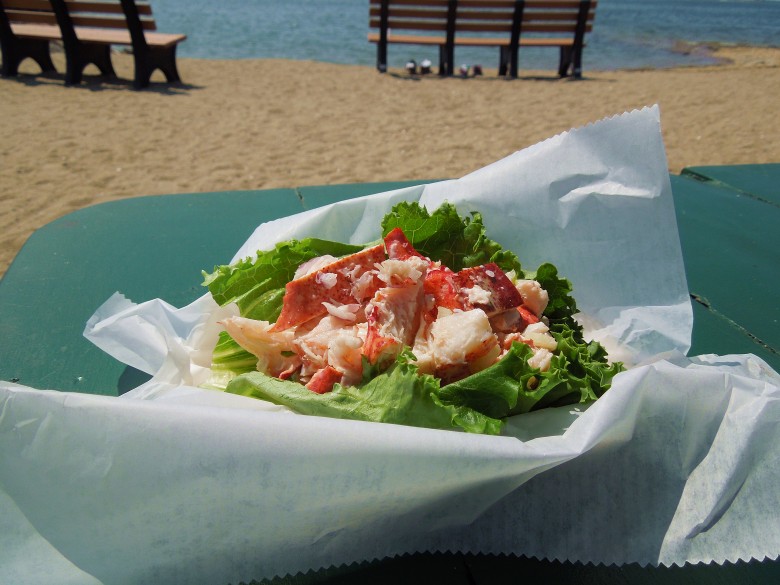Mac’s Seafood serves up a lightly seasoned, healthy lobster roll with a large piece of lettuce as garnish. 