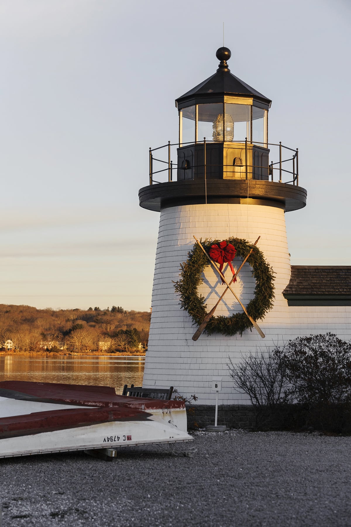 A replica of Nantucket's Brant Point lighthouse adorned with a Christmas wreath at Mystic Seaport.
