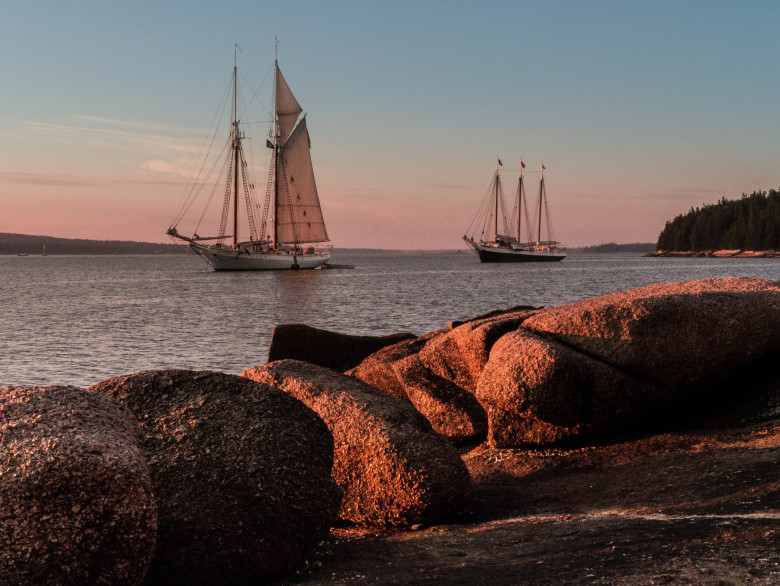 Schooners Mary Day and Victory Chimes sail Penobscot Bay at sunset | Things to Do in Maine