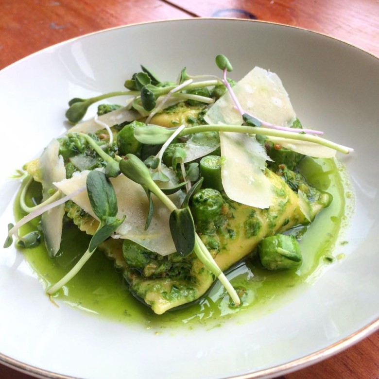 Spring parsnip-filled agnolotti, ramps, and sweet peas.