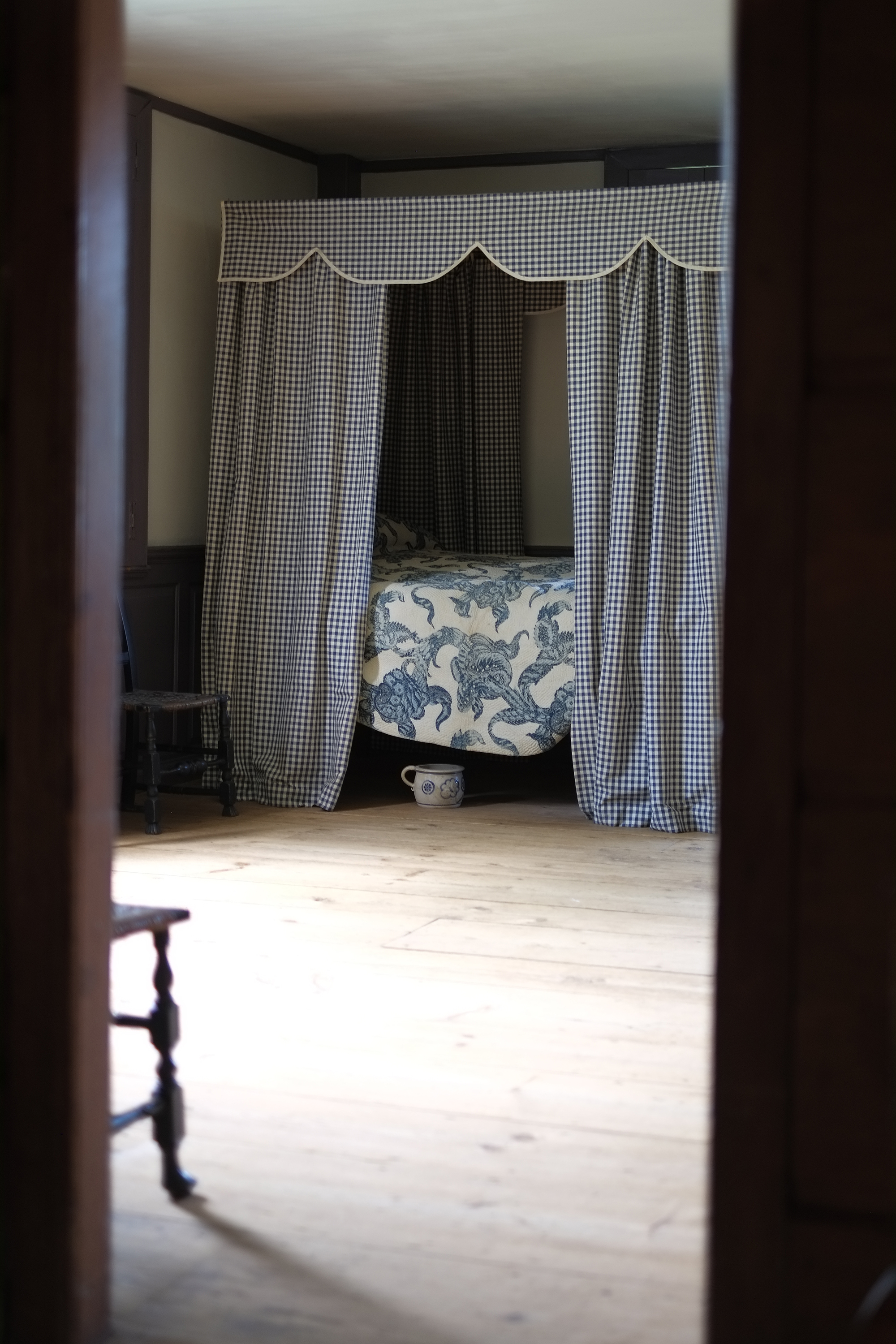 Downstairs bedchamber at Wells-Thorn House with period furnishings including a canopied bed. 