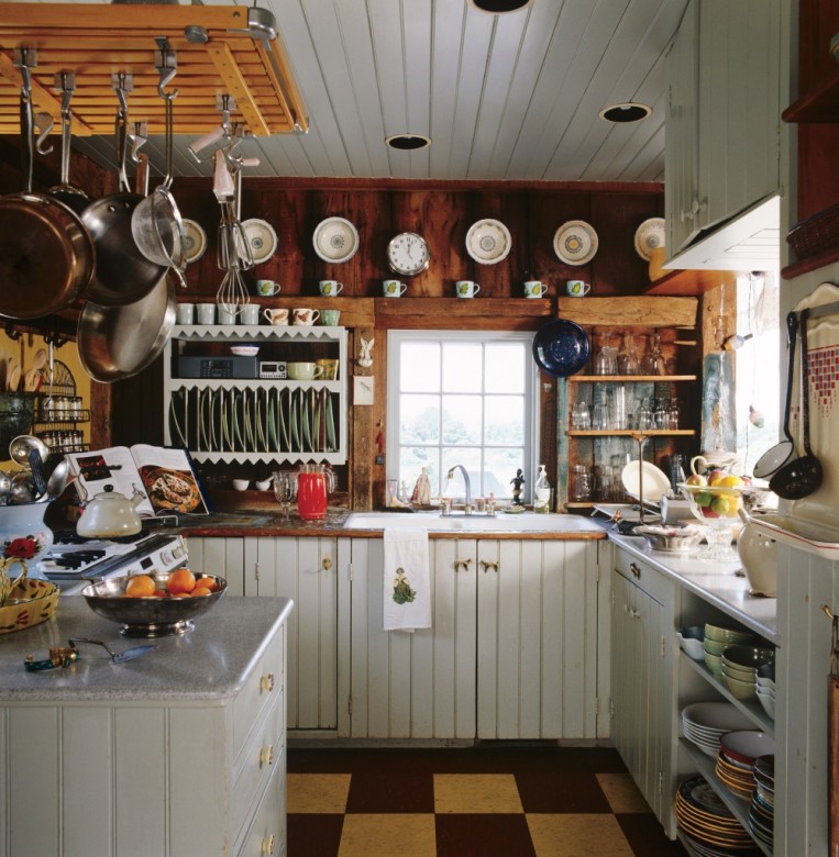 Edie and John’s kitchen is festooned with vintage utensils and ceramics bought at yard sales and Salvation Army stores.