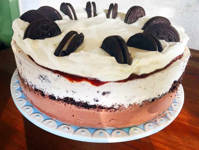This cookies-and-cream cake combines two kinds of ice cream, crushed Oreos, hot fudge, and whipped cream.