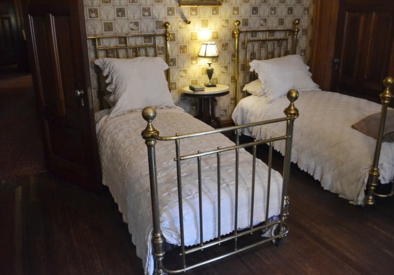 Today's nursery is outfitted with two brass beds, based on Clara Clemens' memories of her childhood. The whimsical wallpaper, a reproduction of the original, tells the story of an animal wedding.