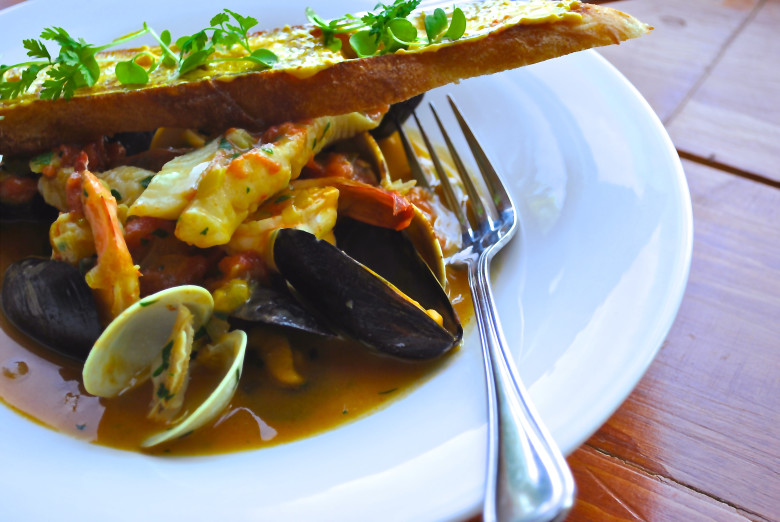 Shellfish bouillabaisse with grilled baguette.