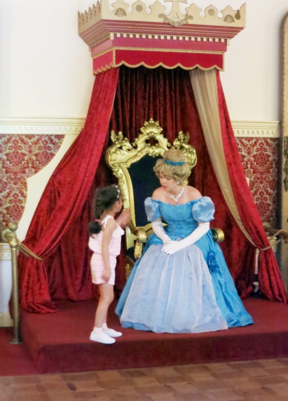 Cinderella meets her adoring subjects from her throne inside the castle. 