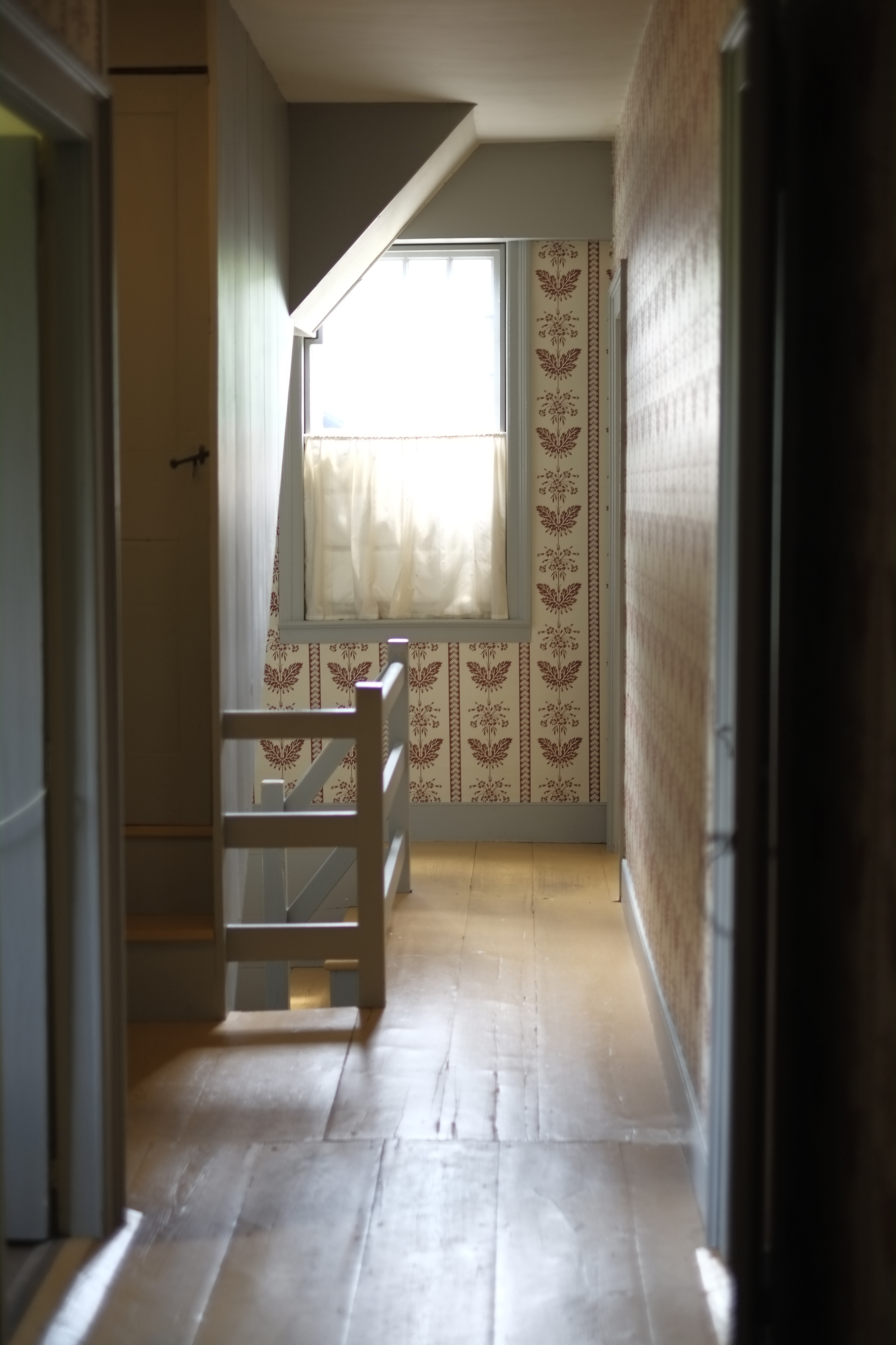 Wallpapered upstairs hallway in Williams House.